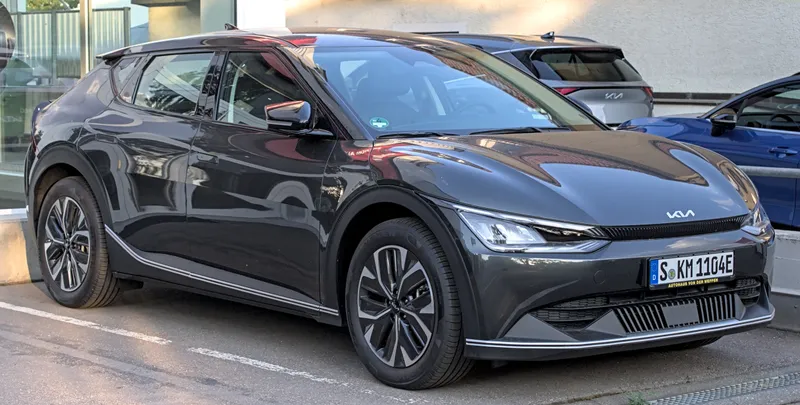 A dark gray Kia EV6 seen from the front right three-quarter angle, parked in Stuttgart, Germany, in July 2023. It is a European-market car photographed before the 2026 model year this post cites.