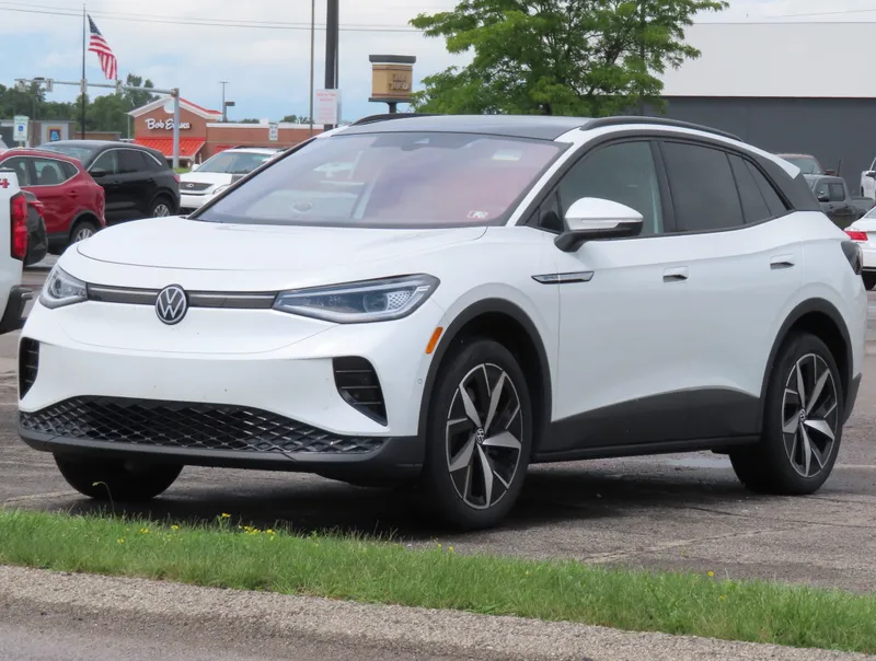 A white 2023 Volkswagen ID.4 Pro S parked in a lot, seen from the front left (driver's side) at a three-quarter angle, the same model year as the recalled 2023 vehicles.